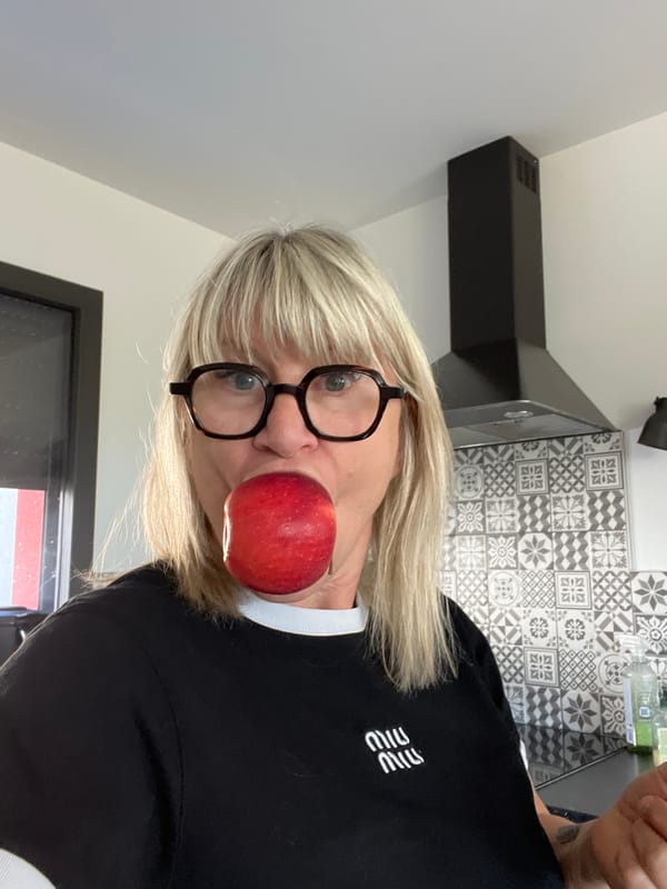 Woman enjoys morning meal in French kitchen