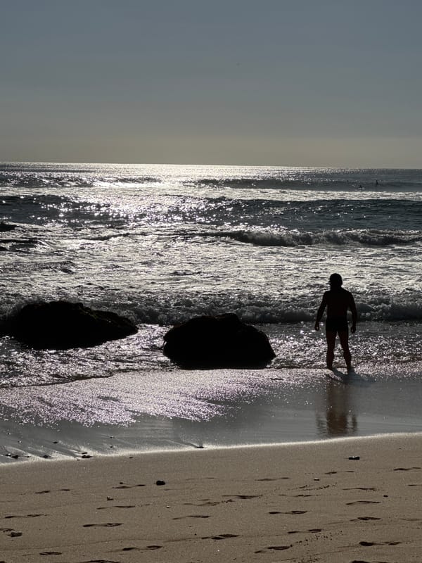 Morning beach life along Kuta Selatan's volcanic shoreline
