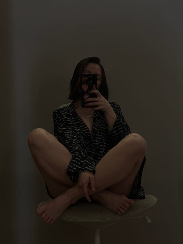 Woman takes multiple selfies in chair, Votkinsk Russia