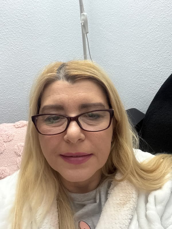 Woman in white robe photographed indoors April 9