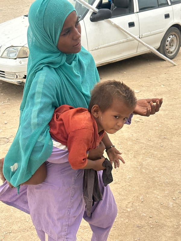 Street life and open skies in Karachi on a June morning