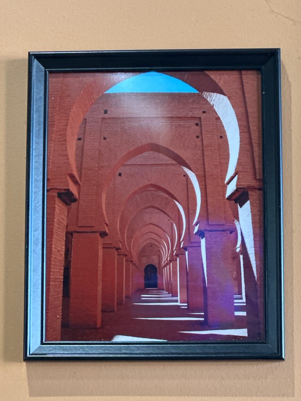 Architectural photography spanning a brick hallway and Jerusalem's Dome of the Rock