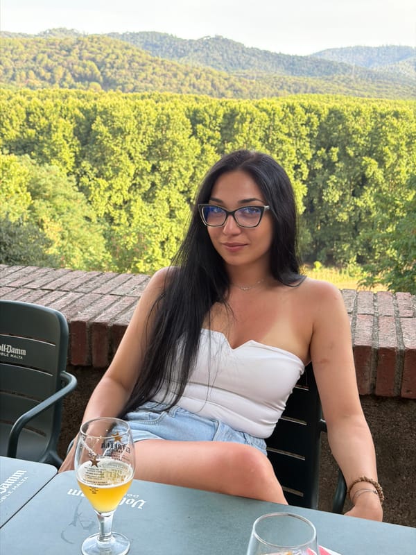 Drinks and conversation at an outdoor table in Hostalric