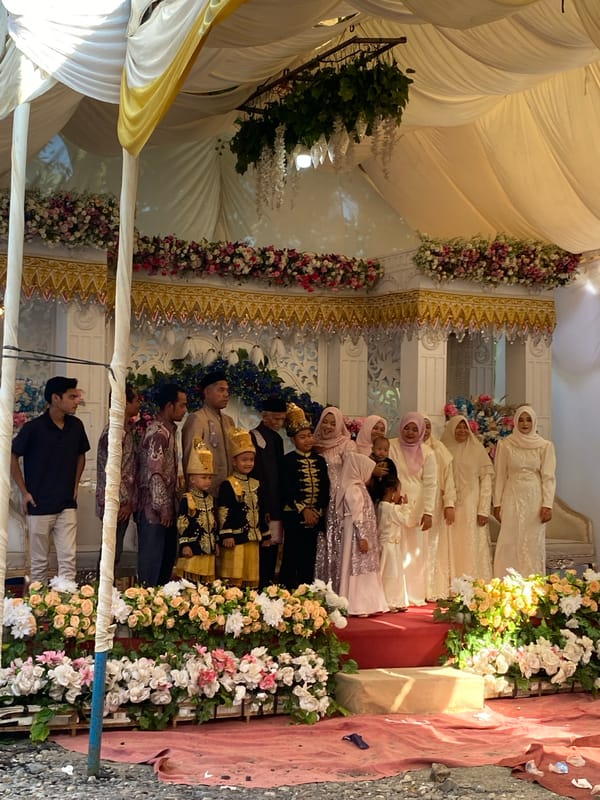 Traditional outdoor celebration with tents and ornate decor, Indonesia