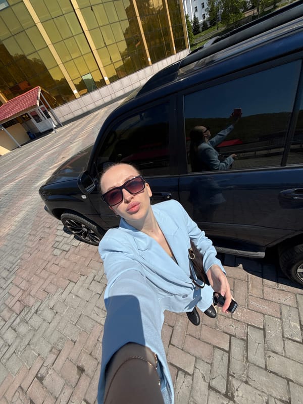 Woman takes selfie in sunny Petropavlovsk-Kamchatsky