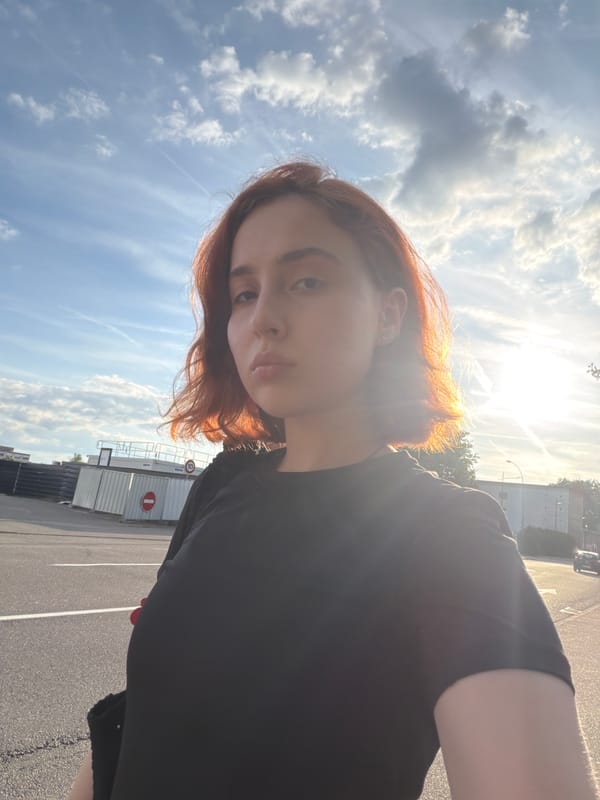 Young woman takes creative selfies in sunny Strasbourg