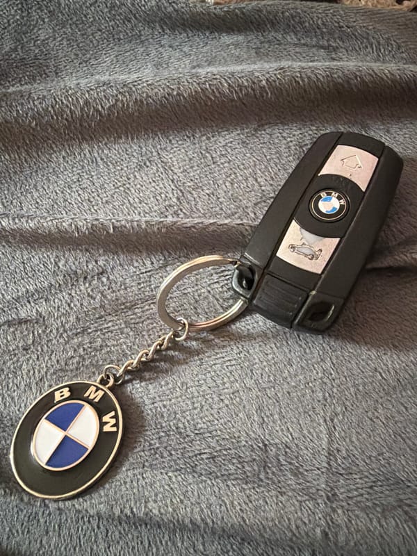 BMW car key spotted on gray surface