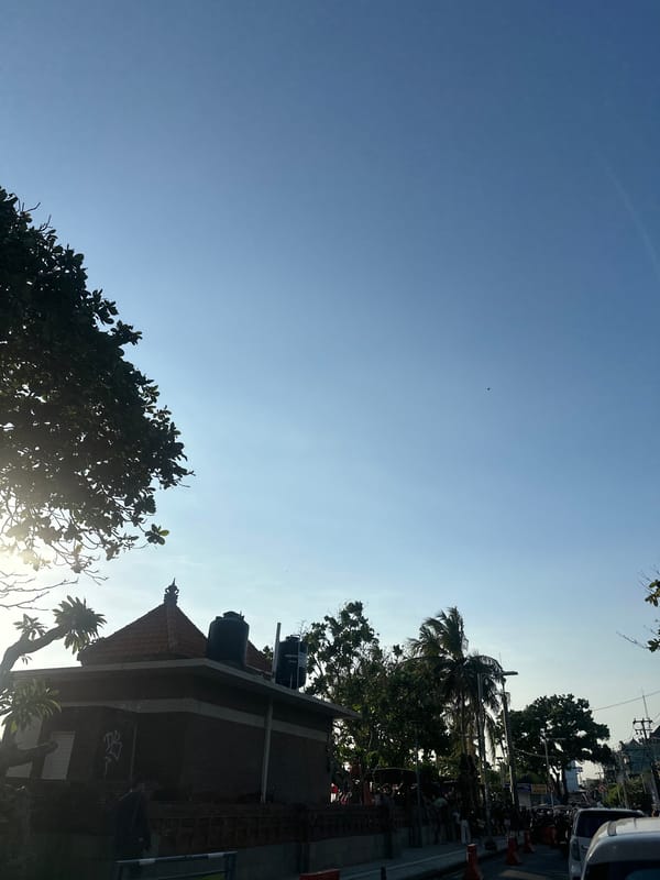 Kuta's tourist strip and beach in full morning swing