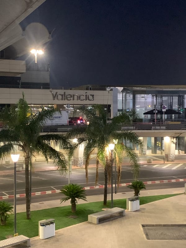 Late-night scenes across Valencia Airport's terminal and parking garage