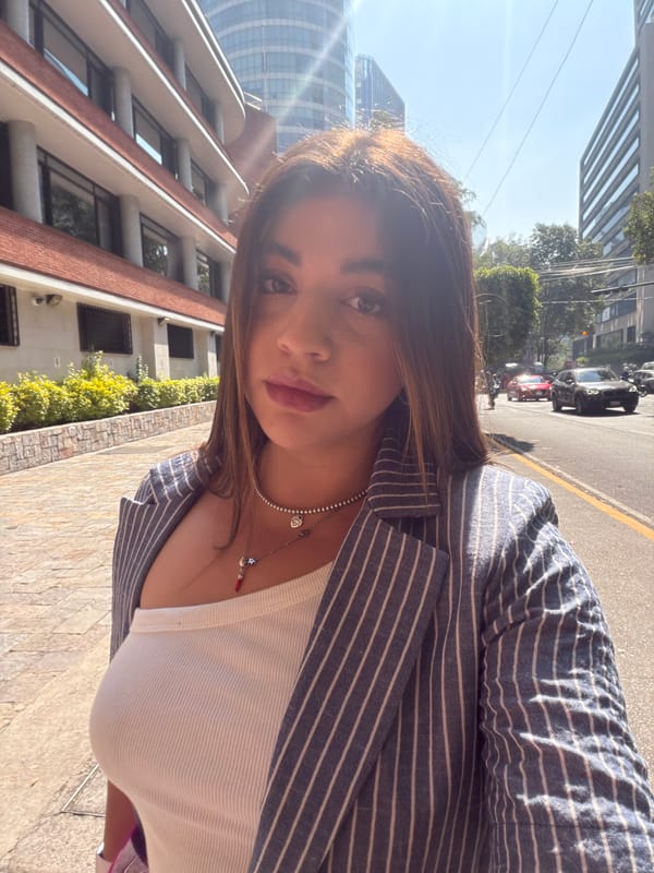 Woman Takes Selfies on Mexico City Sidewalk