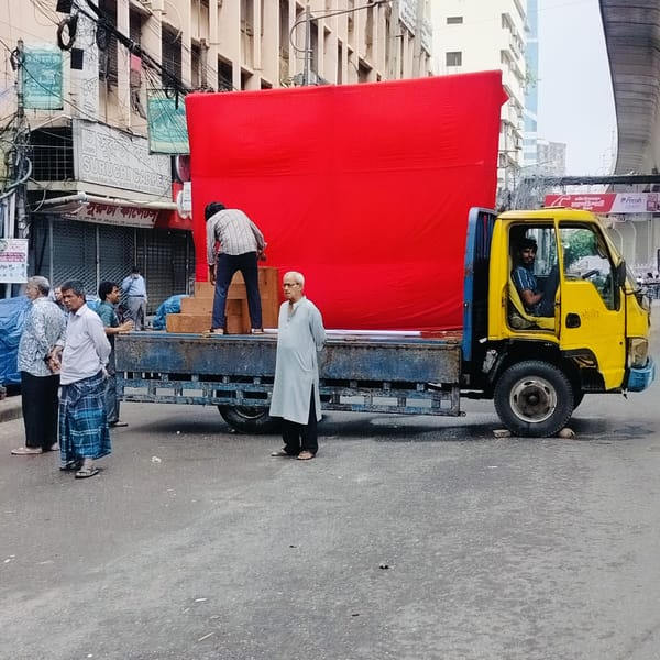 Truck loaded with red structure spotted in Dhaka street