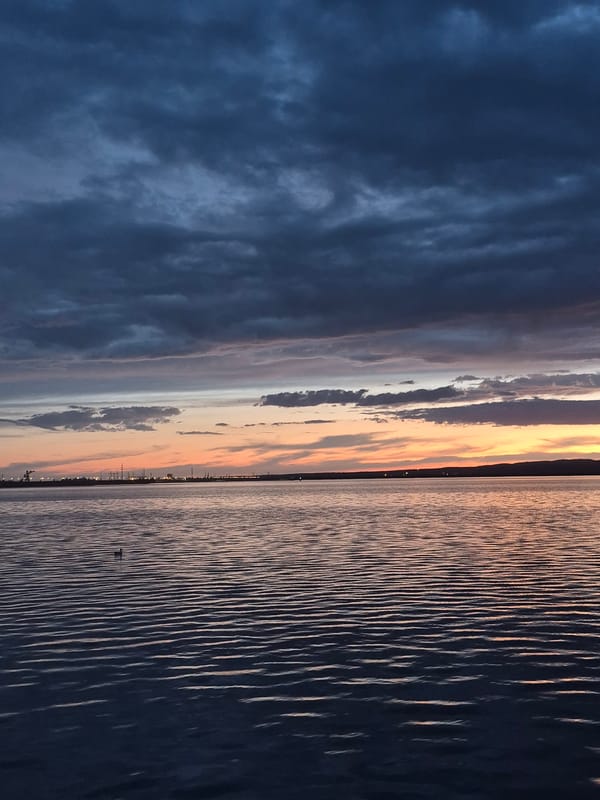 Family enjoys evening riverside park outing in Chaikovsky, Russia
