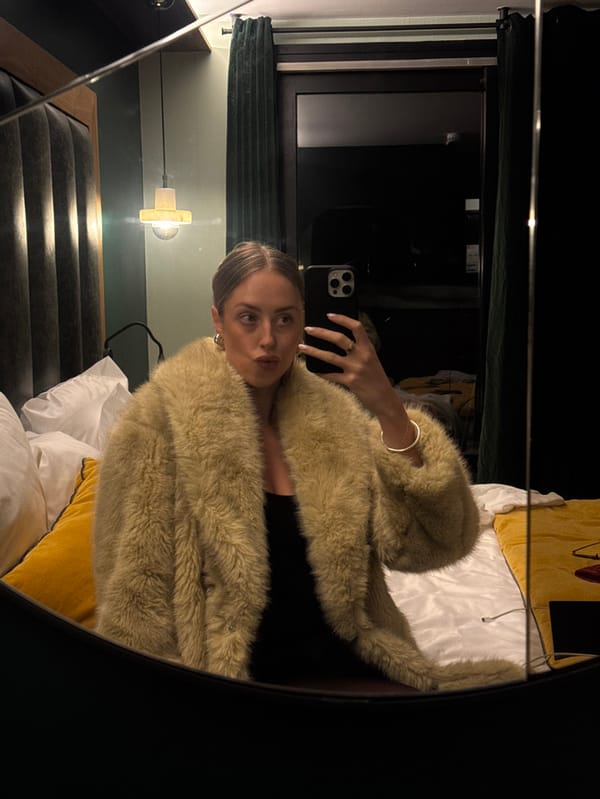 Woman takes fashion selfies in Courchevel hotel room