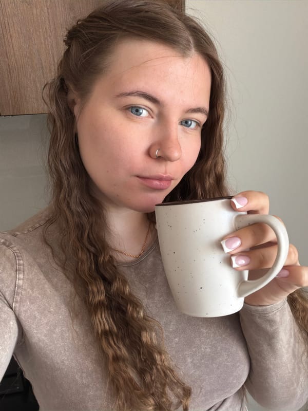 Woman takes morning selfies in Chaikovsky bathroom