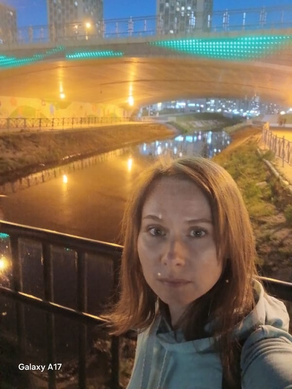 Evening stroll documented through central Yekaterinburg's illuminated cityscape