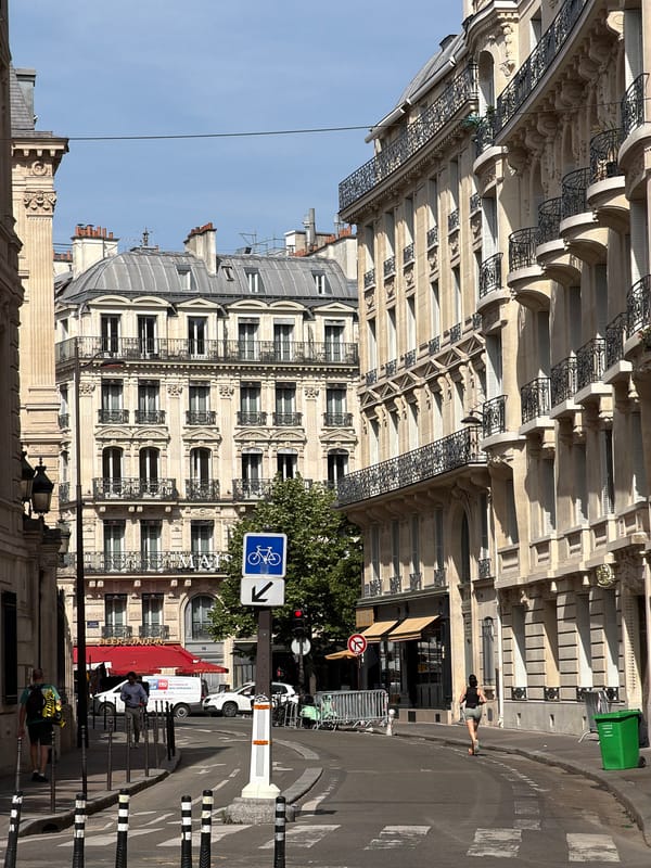 Morning walk through central Paris captures street architecture, café