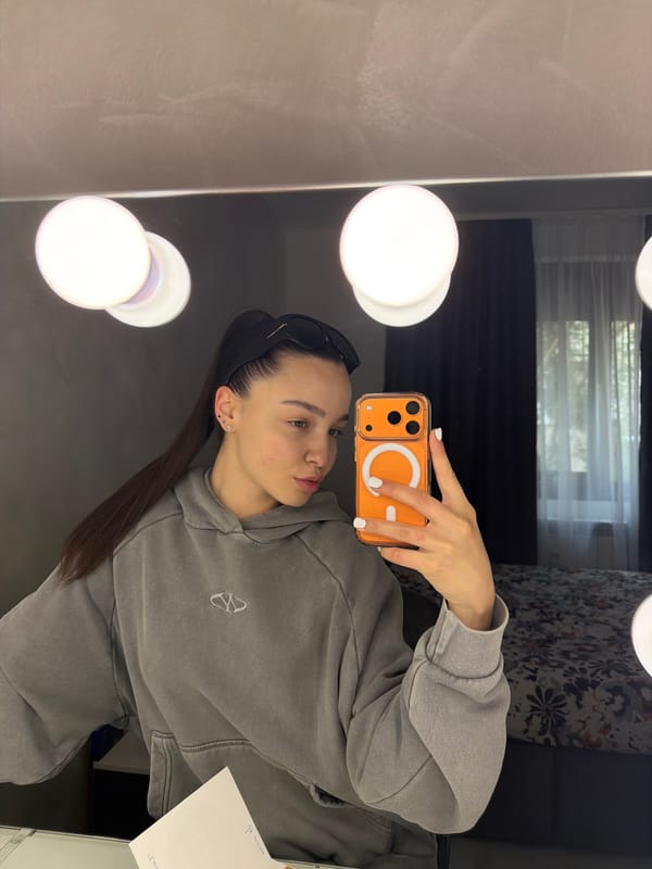 Woman takes morning selfie amid makeup collection in Pernik