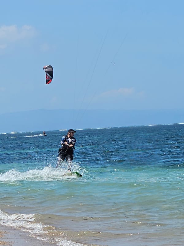 Morning kiteboarding sessions on Denpasar beach with ideal conditions