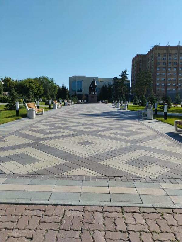 Strolling through Kostanay's civic center and park on a summer morning