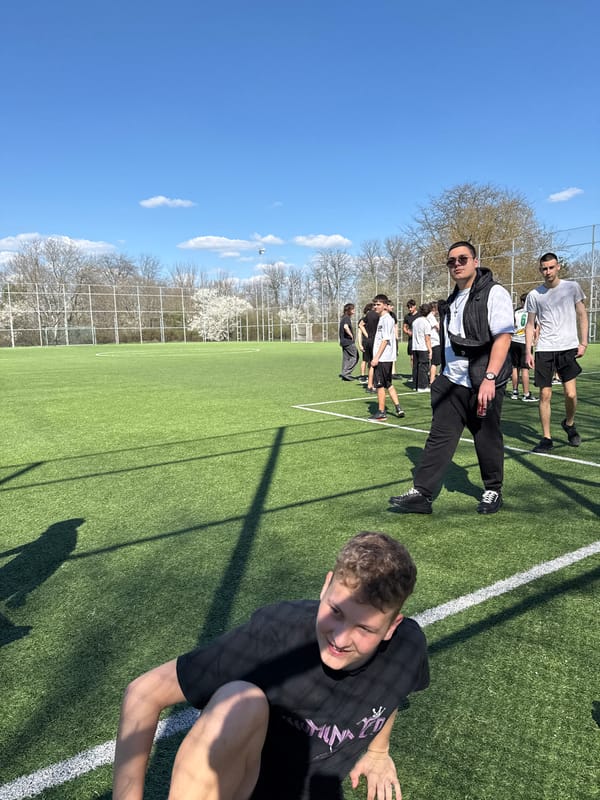 Young men gather on sports field in Dobrich, Bulgaria