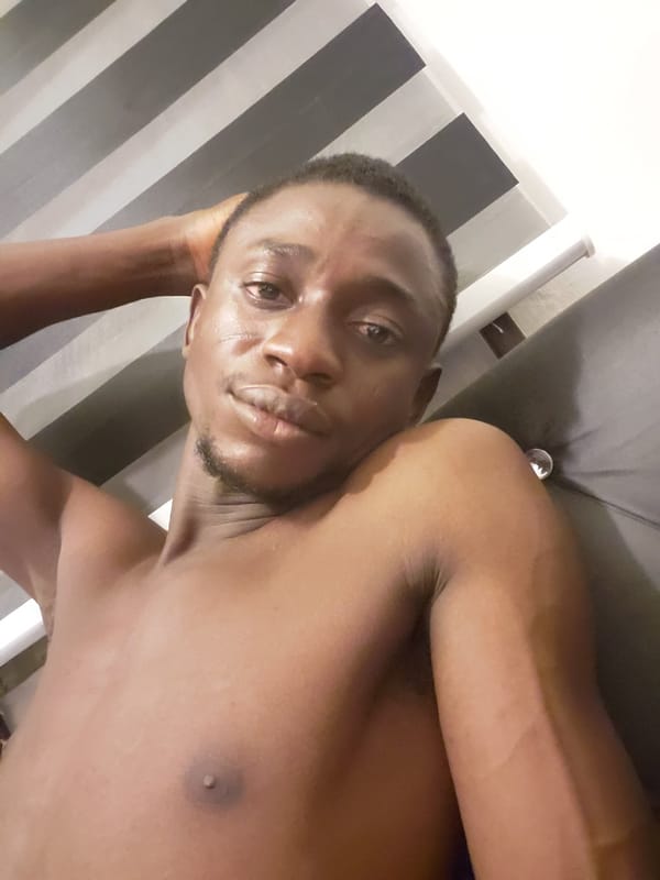 Man takes multiple selfies while resting in Adonkolo, Nigeria