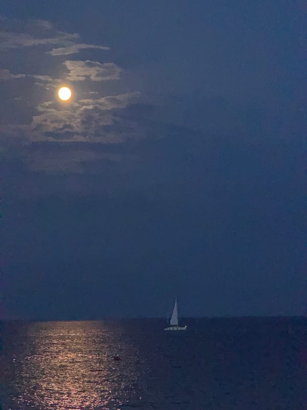 Full moon evening along Barcelona's beachfront promenade