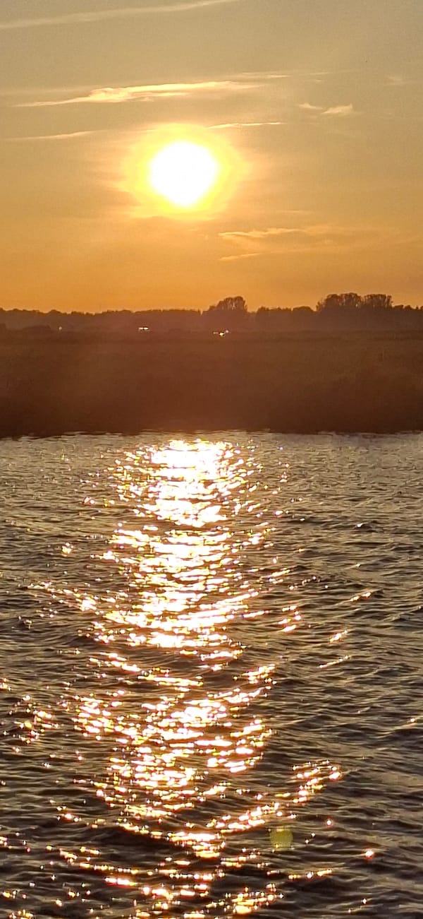 Golden hour on Pärnu Bay, boats and calm water