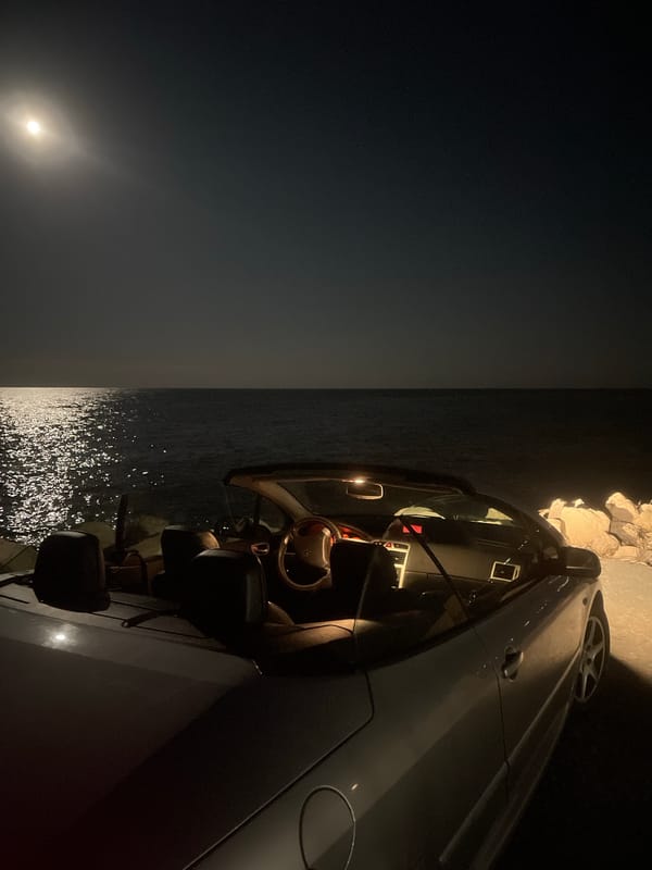 Car parked on Varna cliffs during moonlit evening