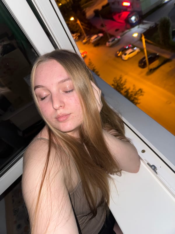 Casual evening portraits and selfies by a window in Perm
