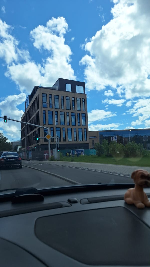 Driving through central Riga on a clear summer afternoon