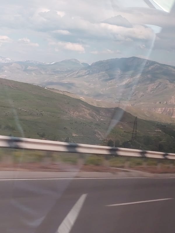 Traveler documents scenic mountain landscape in Chiva, Armenia