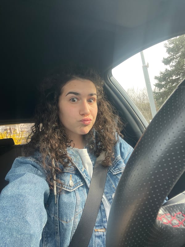 Woman takes playful car selfie in Sofia