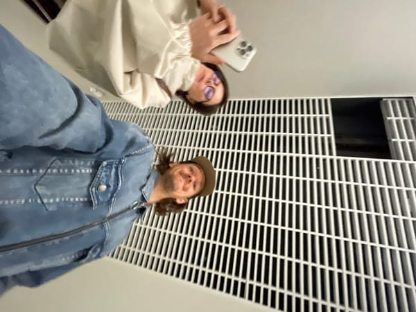 Early morning selfie session in Izhevsk hallway captures two friends