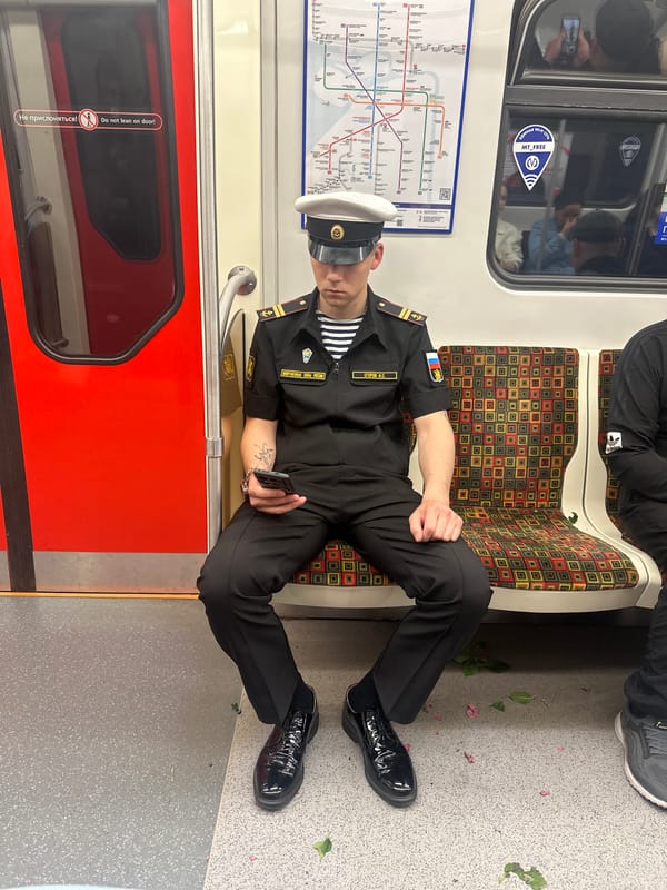 Russian naval officer rides Saint Petersburg subway with smartphone