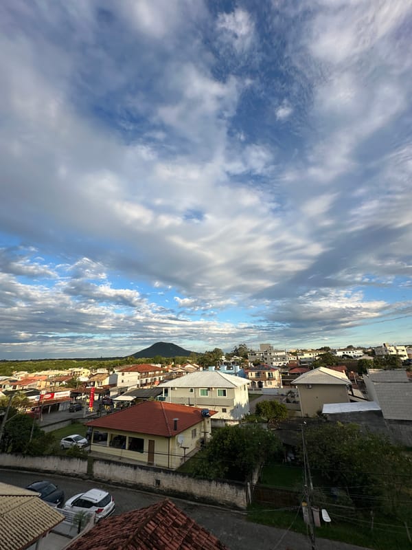 Residential Florianópolis neighborhood documented under partly cloudy evening skies