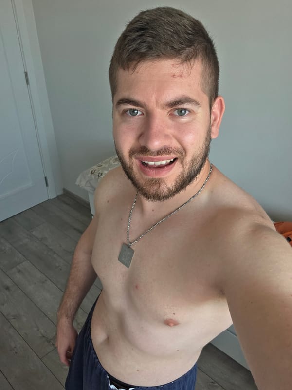Man poses shirtless in Bulgarian residence during early morning