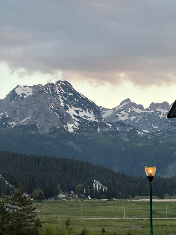 Snow-capped mountains observed in Žabljak, Montenegro evening landscape