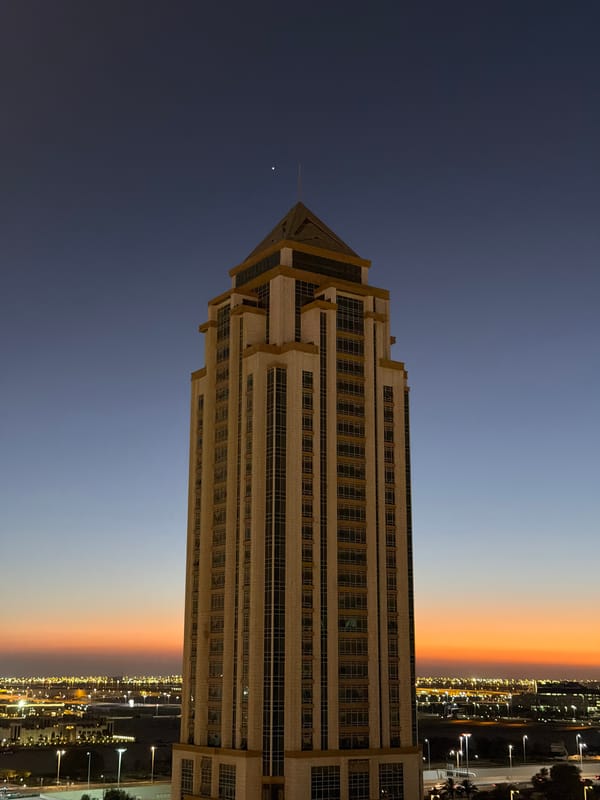 Witnesses document illuminated waterfront cityscape at dusk