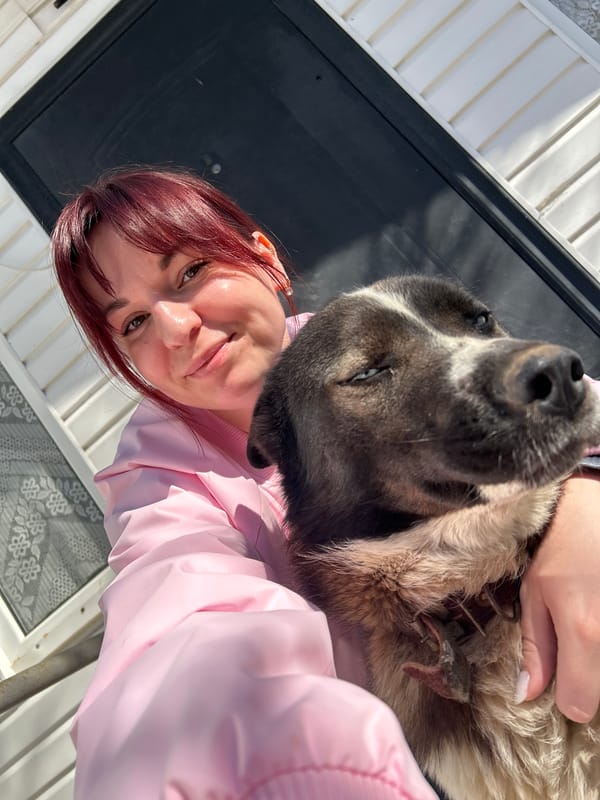 Woman with dog photographed in Фоки, Russia
