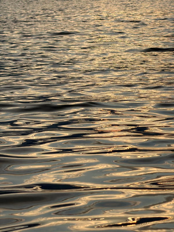 Golden sunset breaks through clouds over the Kama River