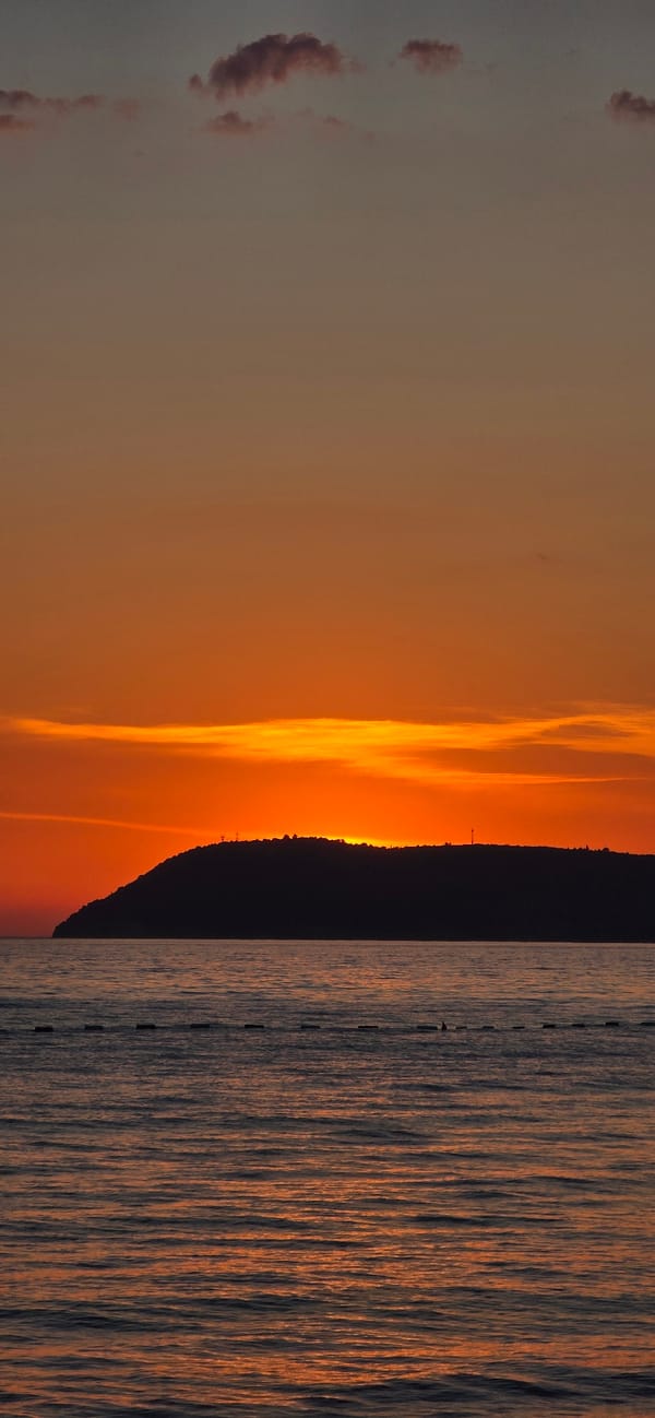 Sunset watchers gather on Bar beach for evening views