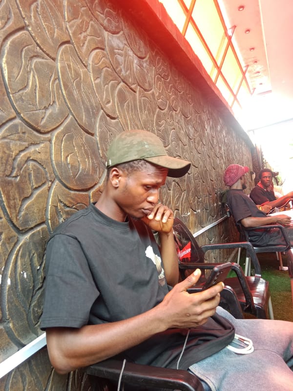 Men gather at outdoor venues in Onitsha, Nigeria