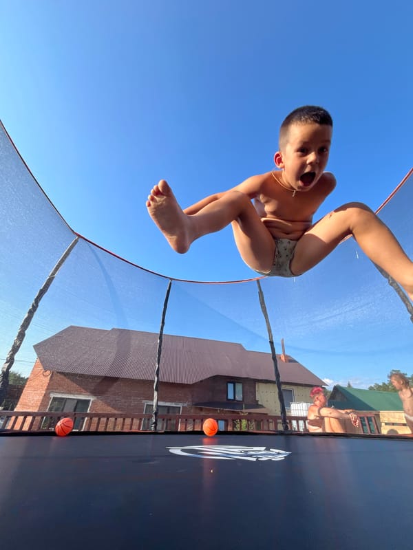 Sunny afternoon outside in Chaikovsky — trampolining and watermelon