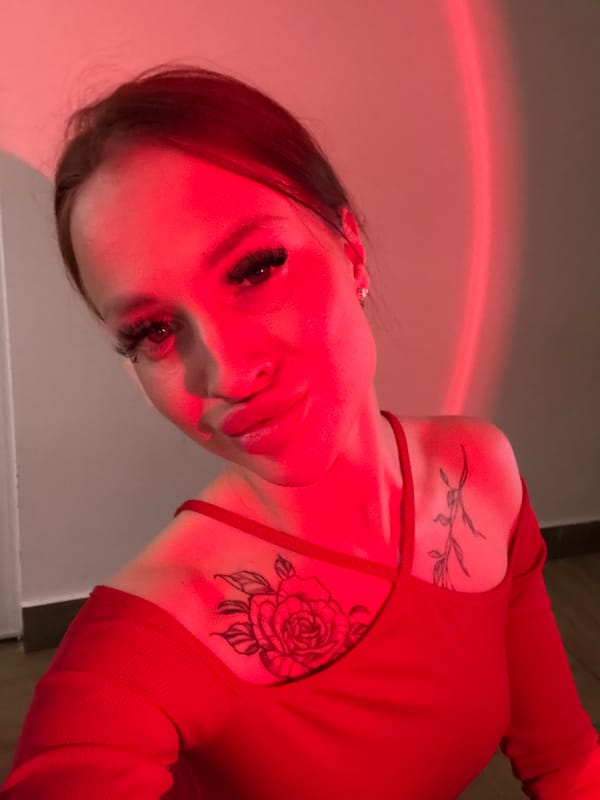 Woman takes artistic selfies with colored lighting in Simferopol