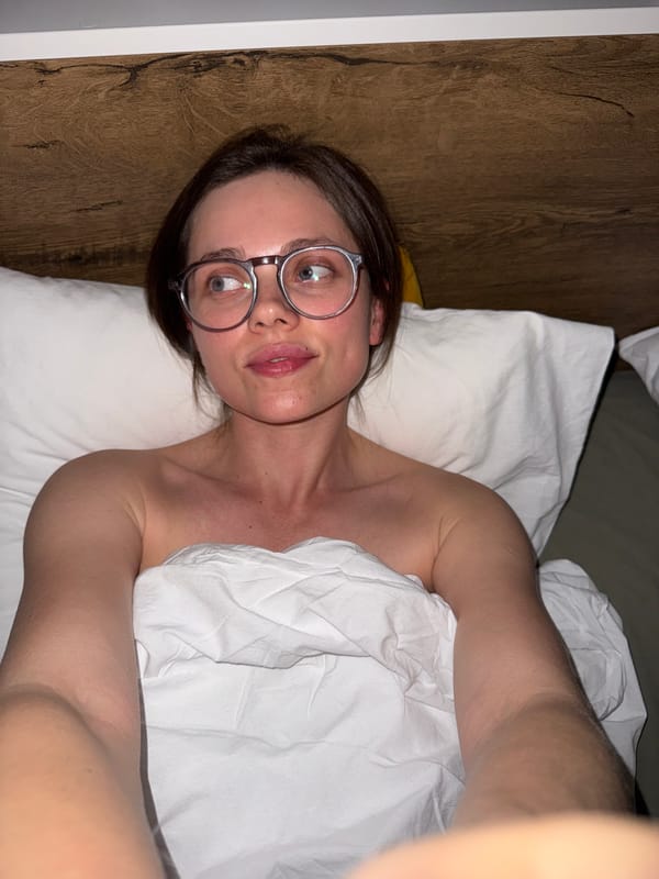 Woman photographed in bed in Budapest apartment
