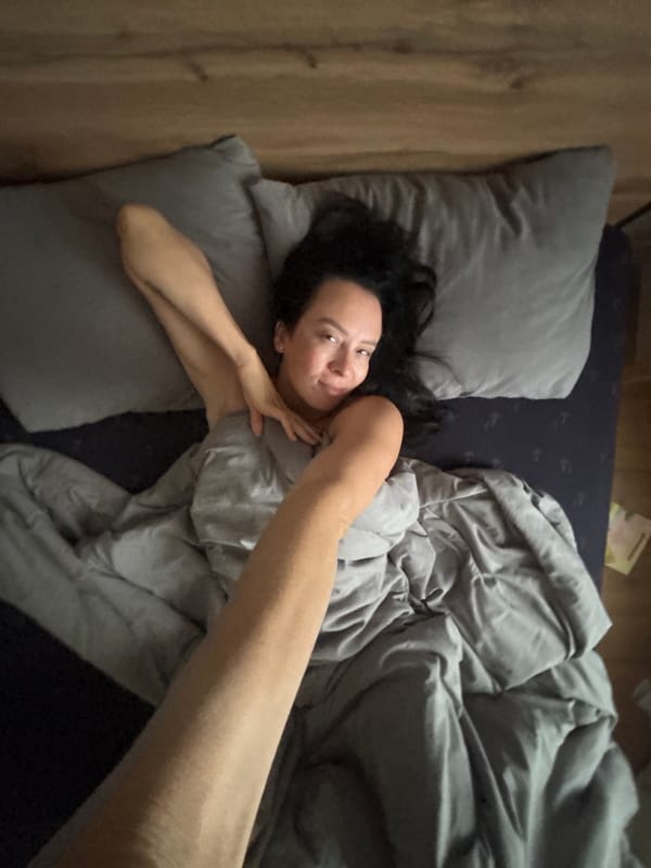 Woman resting in bed photographed in Chaikovsky, Russia