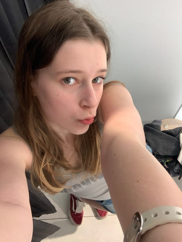 Young woman takes multiple selfies in Belgrade changing rooms