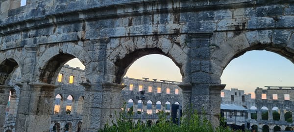 Sunset evening around Pula's Roman amphitheater and harbor