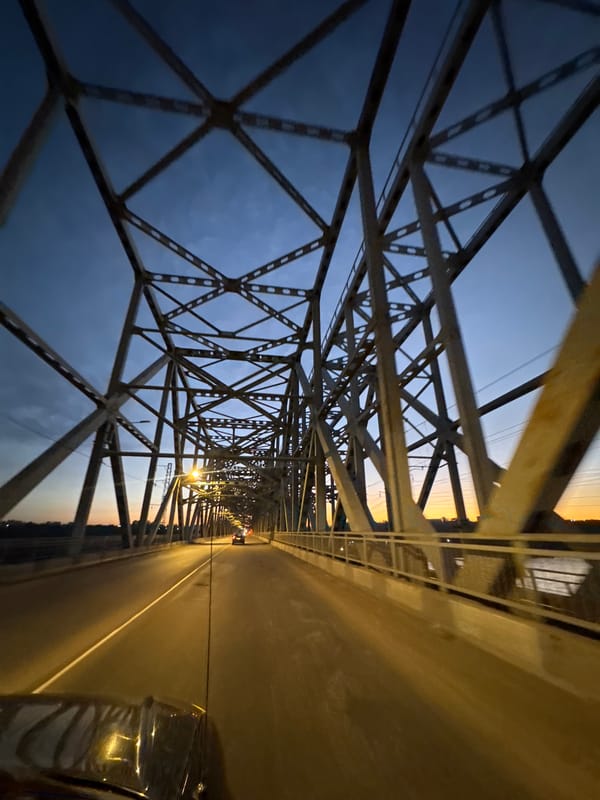 Steel truss bridge in Krasnoyarsk, inside and underneath at dusk