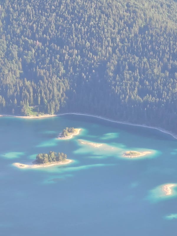Morning aerial view captures serene Eibsee lake in Bavarian Alps